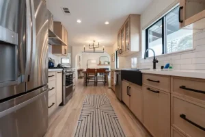 Bright open-concept kitchen and dining area with connected living space