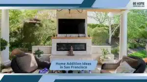 Elegant outdoor lounge with fireplace, greenery, and comfortable seating arrangement