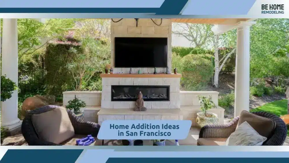 Elegant outdoor lounge with fireplace, greenery, and comfortable seating arrangement